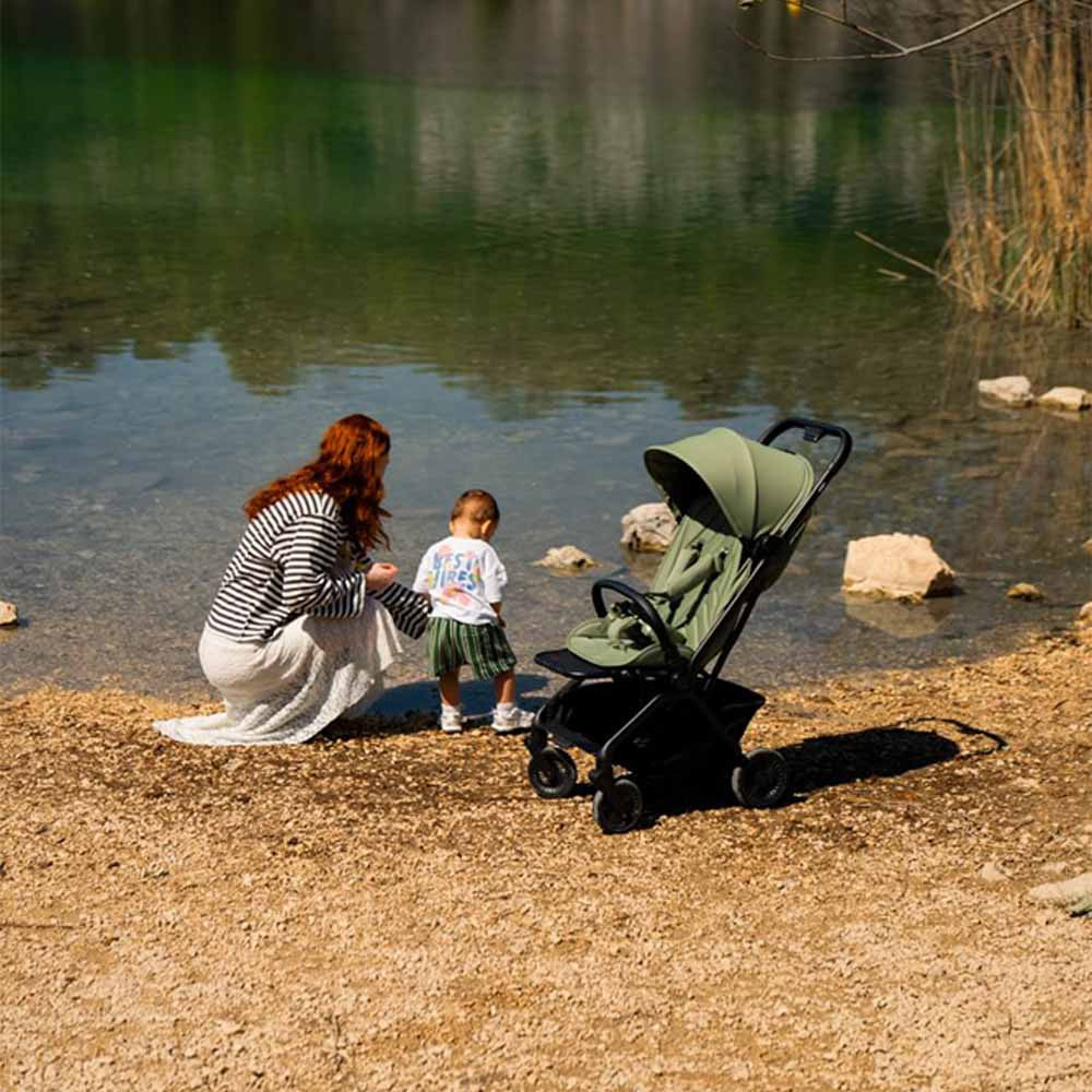 Family using the Avionaut Airby stroller outdoors