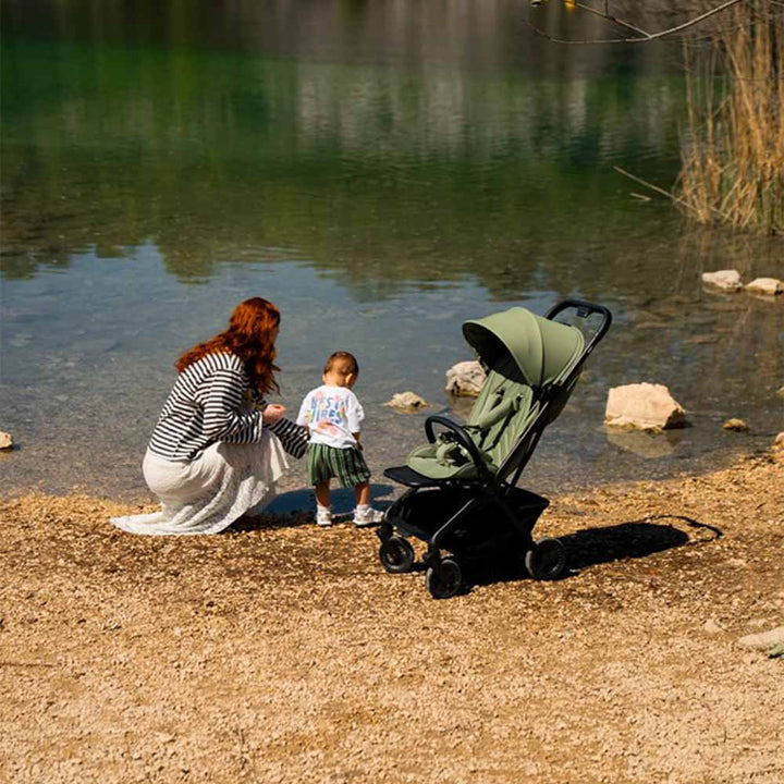 Family using the Avionaut Airby stroller outdoors